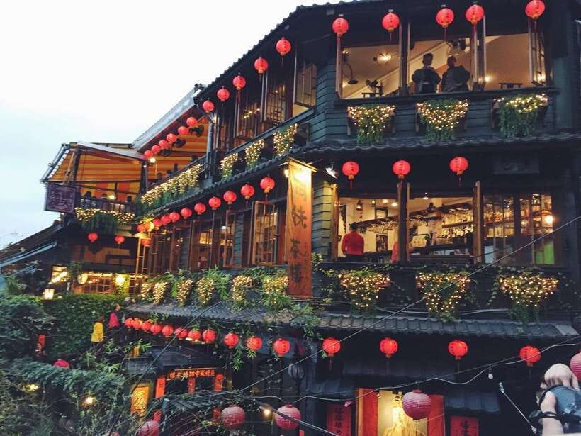 Red lanterns above the tea house steps at Jiufen after sunset
