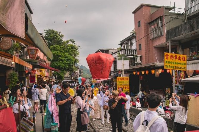 Half Day Private Tour to Jiufen, Shifen Waterfall & Pingxi Sky Lantern - Golden Waterfall in changing weather