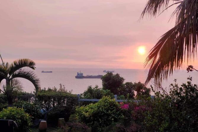 Sunset Dinner on Monkey Mountain - A garden table with the ocean in view