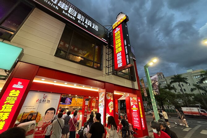 Taipei Foodie and History Walking Tour - Walking toward Ximending after dark